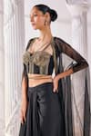Mandira Wirk_Black Net Embroidered Sequin Sweetheart And Cutdana Work Draped Skirt Set_at_Aza_Fashions