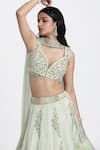 Shop_Nitisha Kashyap Official_Green Silk Hand Embroidered Mirror Leaf Neck Resham Blouse Lehenga Set _Online_at_Aza_Fashions