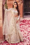 Buy_LASHKARAA_Off White Net Embroidery Zari Sweetheart Neck Bridal Floral Forest Lehenga Set _at_Aza_Fashions