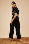 Shop_Bohobi_Black Linen Embroidery Slogan Round Crop Top With Wide Leg Pant _at_Aza_Fashions