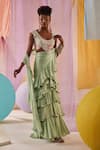 Buy_Anu Pellakuru_Green Raw Silk Embroidery Glass Pre-draped Ruffle Saree With Floral Blouse _at_Aza_Fashions