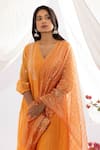 Pants and Pajamas_Orange Chanderi Mull Embroidered Chikankari V-neck Kurta _Online_at_Aza_Fashions