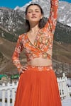 Shop_Nea by Nikita Tiwari_Orange Viscose Georgette Hand Guldasta Lehenga With Wrap Blouse _at_Aza_Fashions