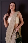 Surabhi Arya_Gold Saree Imported Shimmer Hand Embroidered Leaf Pre-draped With Blouse_Online_at_Aza_Fashions