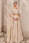 Buy_Nidhika Shekhar_Cream Satin Embroidered Crystal Maharani-e-khaas Floral Bridal Lehenga Set _at_Aza_Fashions