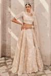 Shop_Nidhika Shekhar_Cream Satin Embroidered Crystal Maharani-e-khaas Floral Bridal Lehenga Set _Online_at_Aza_Fashions