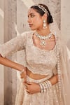 Nidhika Shekhar_Cream Satin Embroidered Crystal Maharani-e-khaas Floral Bridal Lehenga Set _at_Aza_Fashions