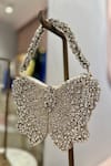 Ozel_Silver Rhinestone Bow Embellished Bag _Online_at_Aza_Fashions