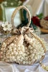 Buy_Ozel_Beige Pearls Bijoux Moti Embellished Potli Bag _Online_at_Aza_Fashions