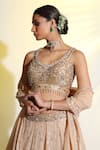 Shop_MeenaGurnam_Beige Blouse Net Hand Embellished Cutdana V Neck Flower Lehenga Set _Online_at_Aza_Fashions