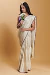 Buy_Surmaye_Ivory Silk Satin Stripe Pattern Rippled Saree _at_Aza_Fashions