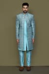 Aryavir Malhotra_Blue Layered Sherwani Jaquard Silk Vine Bloom With Aligadhi Pant _at_Aza_Fashions