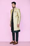 Aryavir Malhotra_Beige Layered Sherwani Jaquard Silk Gardenia Mughal With Aligadhi Pant _at_Aza_Fashions