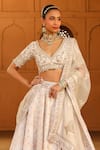 Sheetal Batra_Ivory Blouse And Lehenga Raw Silk Embroidered Kashmiri Tilla V Neck Maryam Set _Online_at_Aza_Fashions