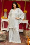 Buy_NIMA FASHIONS_Blue Net Hand Embroidered Sequins Notched Kaftan And Bell Bottom Set _at_Aza_Fashions