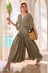 HOUSE OF FETT_Green Cotton Blend V Neck Nusa Pleated Cowl Draped Sleeves Jumpsuit _Online_at_Aza_Fashions