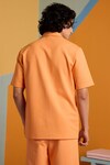 Shop_MUVAZO_Orange Interlock Printed Floral Sunbeam Spectrum Shirt And Shorts Set _at_Aza_Fashions