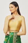 Naintara Bajaj_Gold Muslin Plunge Neck Metallic Sleeveless Solid Blouse _Online_at_Aza_Fashions