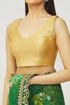 Naintara Bajaj_Gold Muslin Plunge Neck Metallic Sleeveless Solid Blouse _at_Aza_Fashions