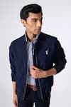 Shop_S&N by Shantnu Nikhil_Blue Poly Blend Embroidered Batsman Logo Placed Bomber Jacket _Online_at_Aza_Fashions