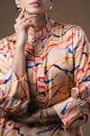 Shop_KHUSHBOO HARAN BORKAR_Coral Cupro Satin Printed Abstract Mandarin Collar Kurta And Pant Set _at_Aza_Fashions