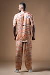 KHUSHBOO HARAN BORKAR_Peach Cupro Satin Printed Wave Shirt Pant Co-ord Set _Online_at_Aza_Fashions