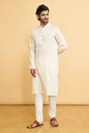 Buy_Arihant Rai Sinha_Cream Poly Cotton Woven Geometric Paisley Kurta And Churidar Set _at_Aza_Fashions