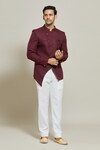 Buy_Aryavir Malhotra_Maroon Terry Rayon Asymmetric Solid Bandhgala And Trouser Set_at_Aza_Fashions