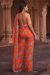 Shop_DiyaRajvvir_Orange Crepe Printed Floral Round Pre-draped Pant Saree With Blouse_at_Aza_Fashions