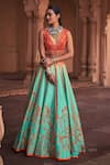 Buy_DiyaRajvvir_Green Tulle Embroidery Cutdana V Neck Rafflesia Bloom Sequin Lehenga Set_at_Aza_Fashions