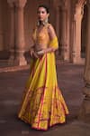 Buy_DiyaRajvvir_Yellow Tulle Embroidery Cutdana V Neck Zinnia Fleur Sequin Lehenga Set_at_Aza_Fashions