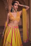 DiyaRajvvir_Yellow Tulle Embroidery Cutdana V Neck Zinnia Fleur Sequin Lehenga Set_Online_at_Aza_Fashions