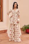 Buy_Chhavvi Aggarwal_Ivory Crepe Printed Floral V Neck Peplum Kurta Sharara Set _at_Aza_Fashions