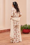 Shop_Chhavvi Aggarwal_Ivory Crepe Printed Floral V Neck Peplum Kurta Sharara Set _at_Aza_Fashions