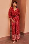 Buy_Chhavvi Aggarwal_Red Crepe Printed Flower Stripe V Neck Jumpsuit _at_Aza_Fashions