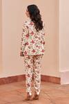 Shop_Chhavvi Aggarwal_Ivory Crepe Printed Floral Jacket Lapel Collar Blossom Pant Set _at_Aza_Fashions