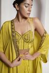 Shop_DEEPIKA CHOPRA_Yellow Indian Crepe Hand Embroidered Tassel Bustier Salli Pant Set With Cape_at_Aza_Fashions
