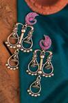 Shop_Mero Jewellery_Pink Stones Temple Tear Drop Carved Earrings _at_Aza_Fashions