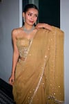 Buy_Label Sanya Gulati_Gold Net Embroidery Glass Bead Sweetheart Neck Tiered Lehenga Saree With Blouse 