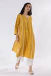 Buy_Pants and Pajamas_Yellow Dobby Cotton Embroidered Thread Notched Kurta And Flared Pant Set _at_Aza_Fashions