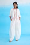 Buy_Nikasha_White Cotton Rayon Blend Flower Sequins Candy Striped Baggy Pant _at_Aza_Fashions