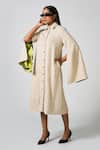 Buy_Pocketful Of Cherrie_Off White Cotton Cloud Textured Sera Mantella Cape Sleeve Dress _at_Aza_Fashions