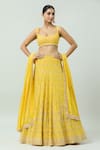 Buy_ANUSHKA KHANNA_Yellow Silk Crepe Embellished Bead Scoop Geometric Bridal Lehenga Set _at_Aza_Fashions