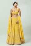 Shop_ANUSHKA KHANNA_Yellow Silk Crepe Embellished Bead Scoop Geometric Bridal Lehenga Set _Online_at_Aza_Fashions