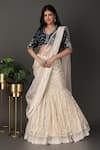 Buy_Nidhi Kejriwal_Off White Velvet Hand Embroidered Border Pre-draped Lehenga Saree With Blouse _at_Aza_Fashions