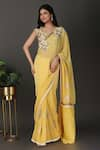 Nidhi Kejriwal_Yellow Georgette Hand Embroidered Floral Sweetheart Border Saree With Blouse _Online_at_Aza_Fashions