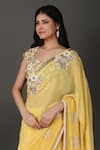 Nidhi Kejriwal_Yellow Georgette Hand Embroidered Floral Sweetheart Border Saree With Blouse _at_Aza_Fashions