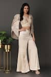 Nidhi Kejriwal_Ivory Satin Embroidered Plunging V Tissue Cutwork Cape Palazzo Set _at_Aza_Fashions