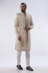 Buy Kommal Sood Beige Cotton Silk And Chanderi Cutdana Moti Sherwani Churidar Set at Aza Fashions Buy_Kommal Sood_Beige Cotton Silk And Chanderi Cutdana Moti Sherwani Churidar Set _at_Aza_Fashions