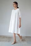 Shop_Merakus_White Cotton Plain Round Neck Pleated Yoke Dress _Online_at_Aza_Fashions